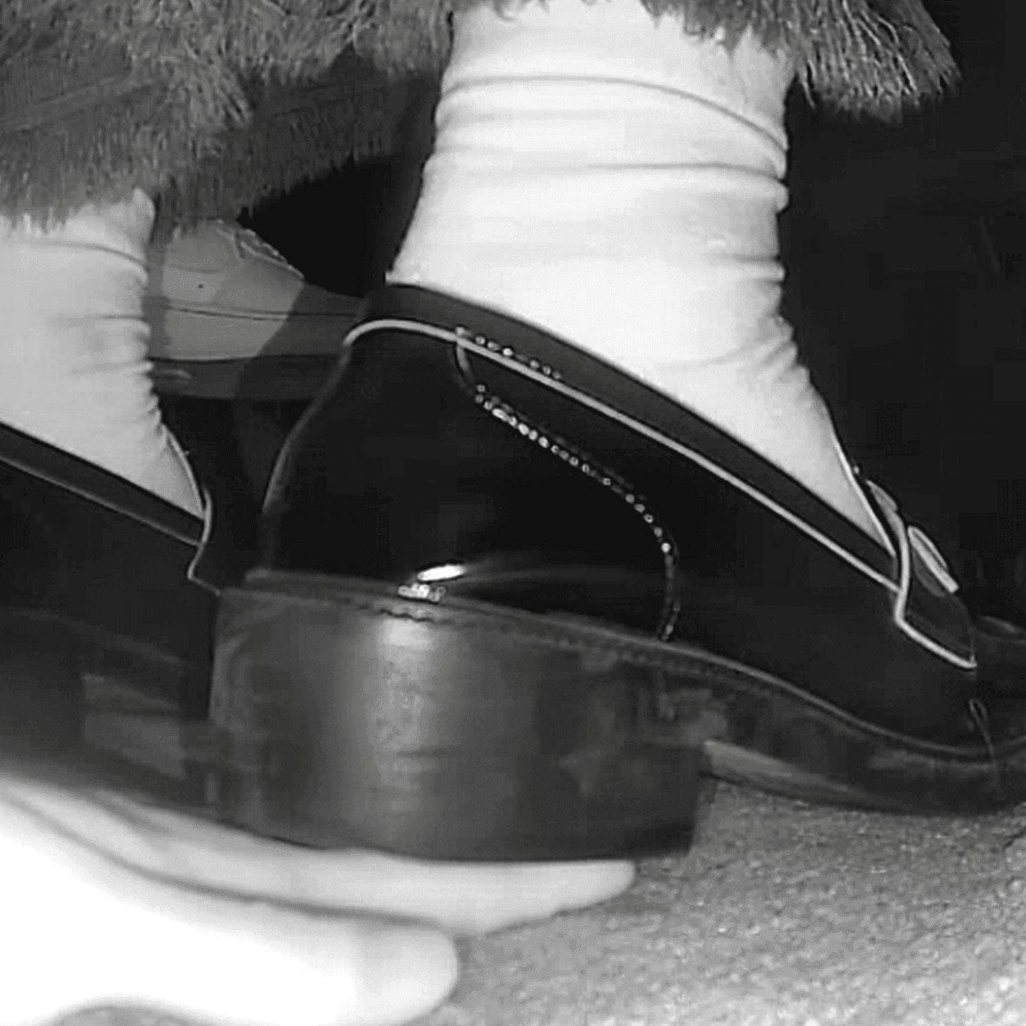 Cinema girl white socks and chunky-heeled leather shoes candid hand trample