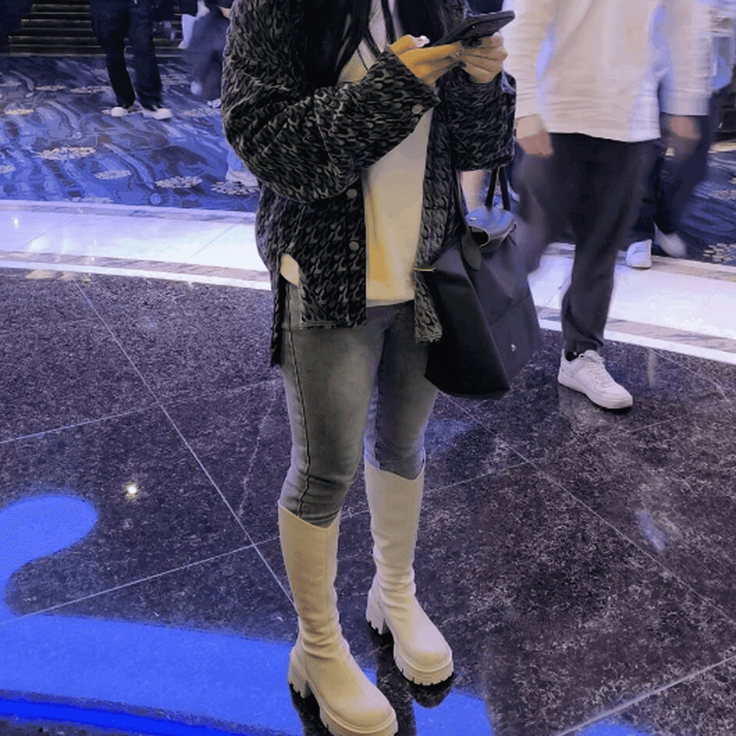Woman wearing white boots candid crush in cinema