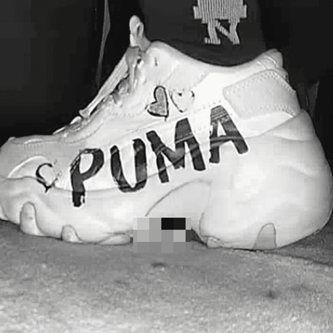 Woman with PUMA sneaker candid crush in the cinema