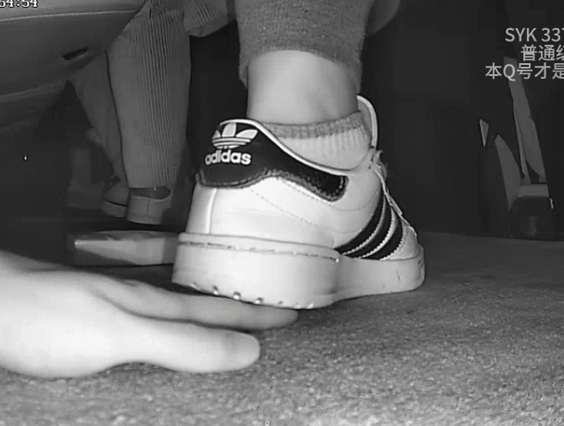 Two girls in movie theater candid hand trample with Adidas + Gucci sneakers