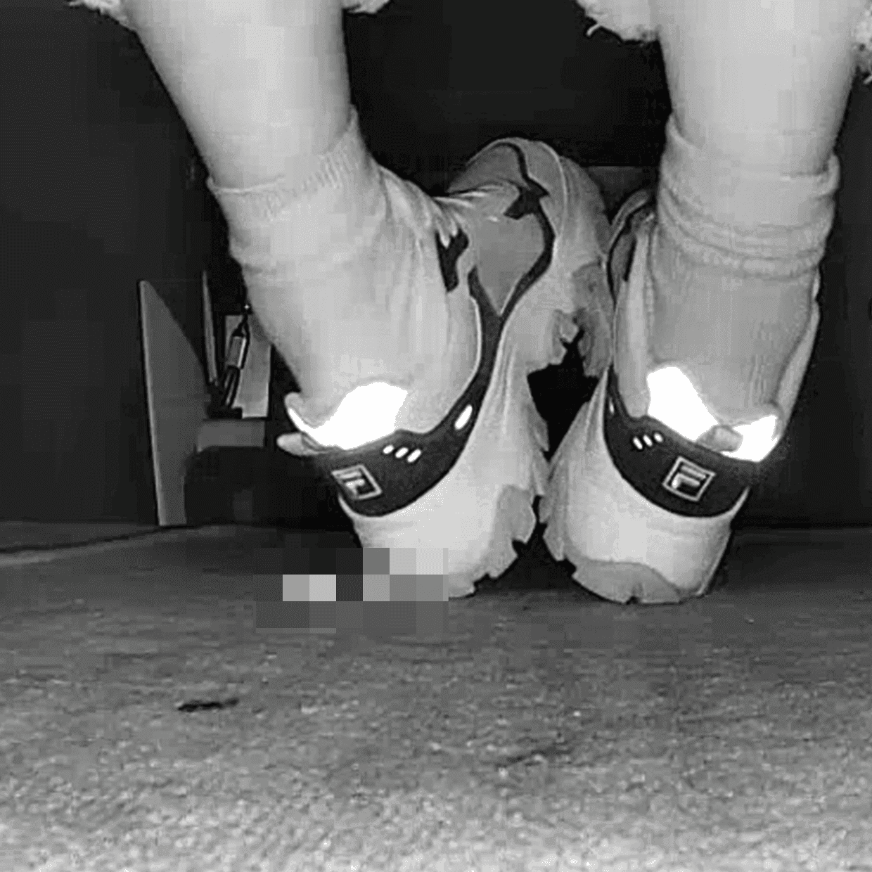 Beautiful woman wearing Fila sneaker candid crush in movie theater