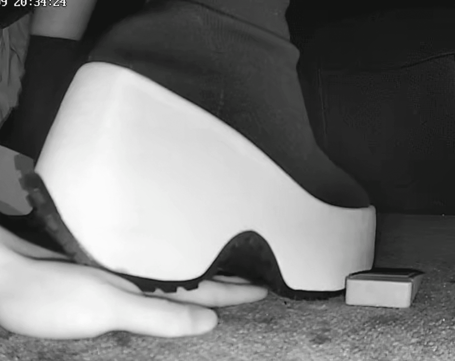 Girl candid hand trample with platform shoes in cinema + candid crush