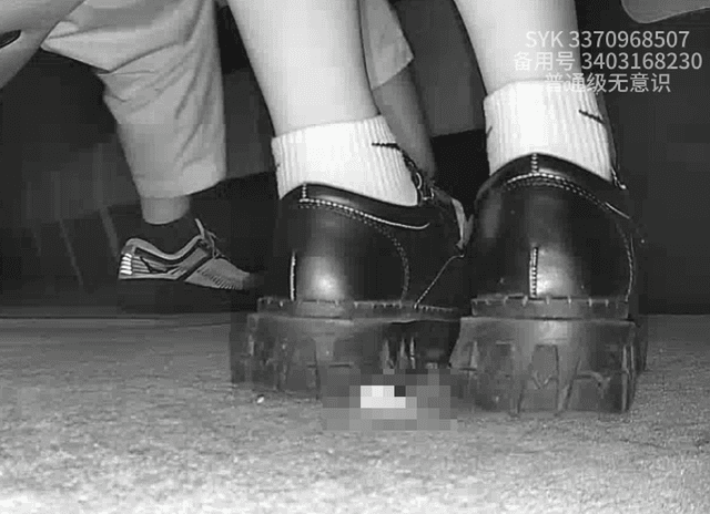 Girl wearing white socks and leather shoes with her boyfriend candid crush at the cinema