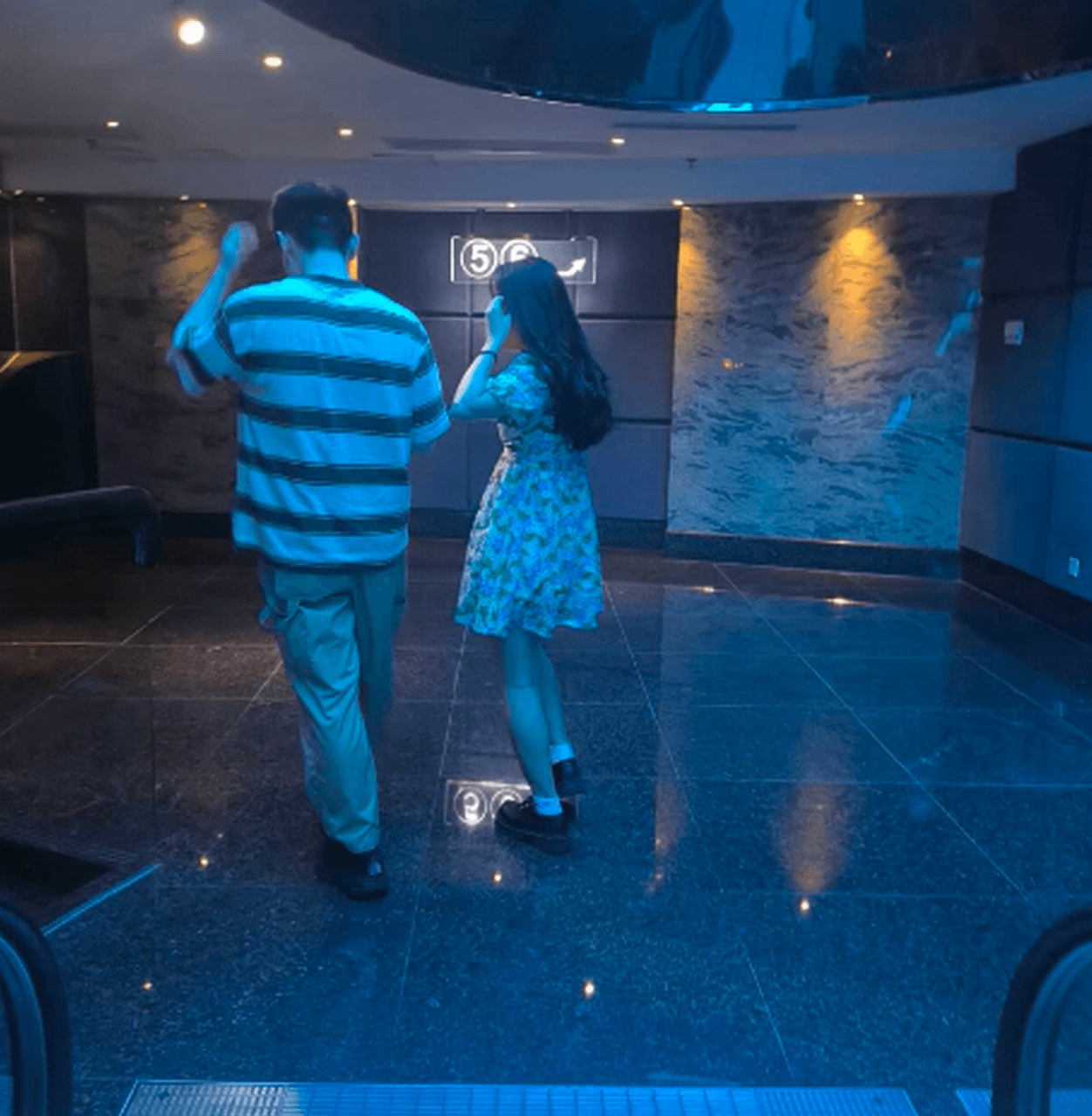 Girl wearing white socks and leather shoes with her boyfriend candid crush at the cinema