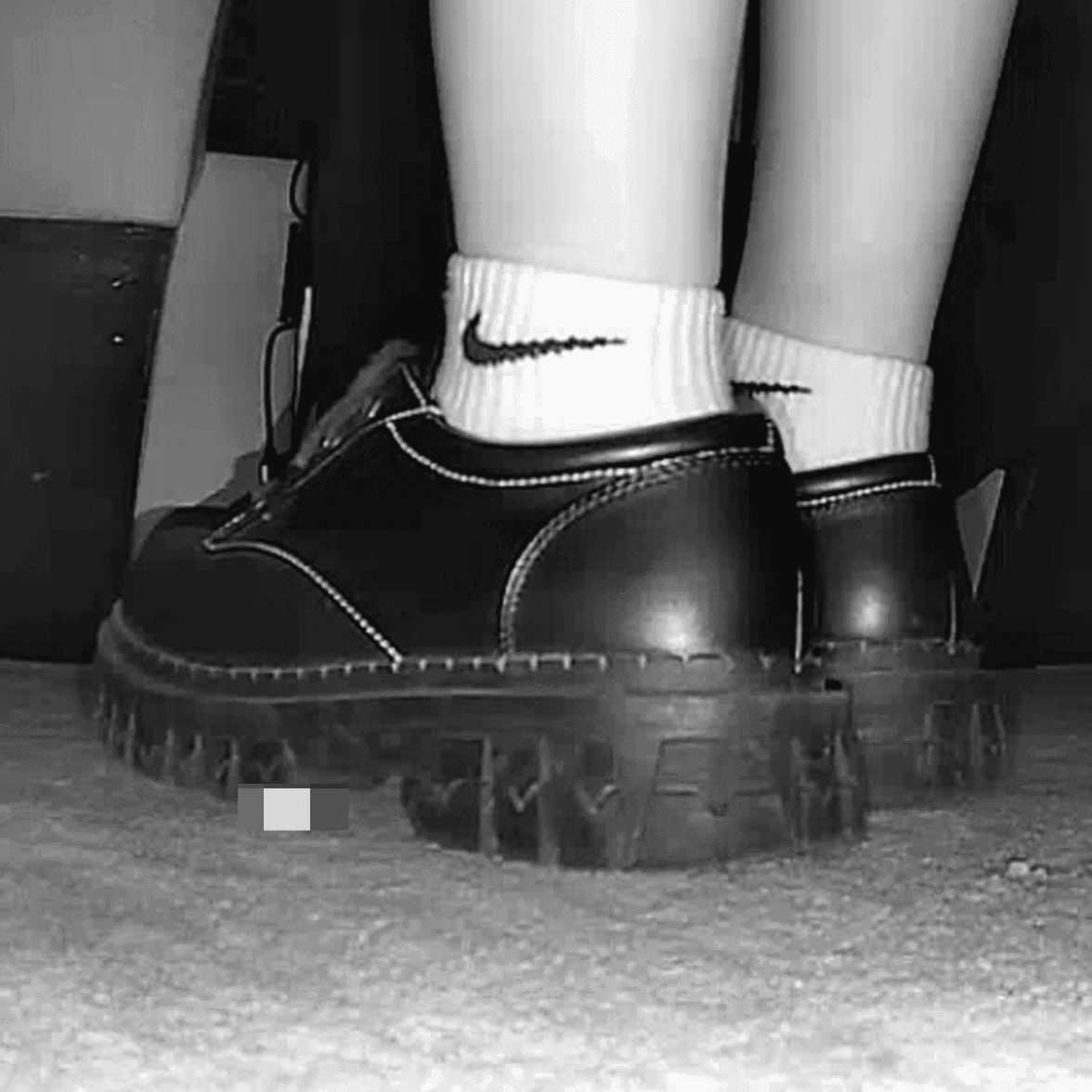 Girl wearing white socks and leather shoes with her boyfriend candid crush at the cinema