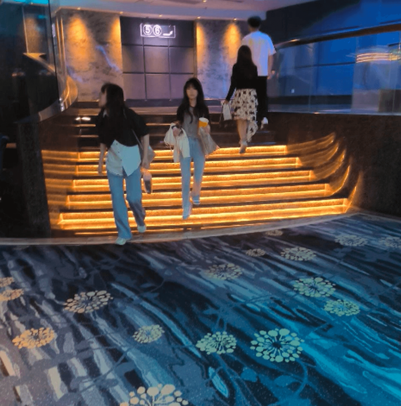 Girl in movie theater candid trample on hand with Nike Air Jordan sneakers