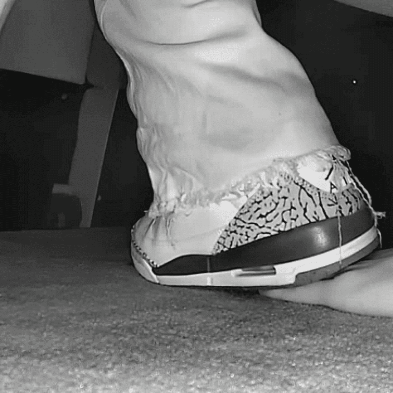 Girl in movie theater candid trample on hand with Nike Air Jordan sneakers