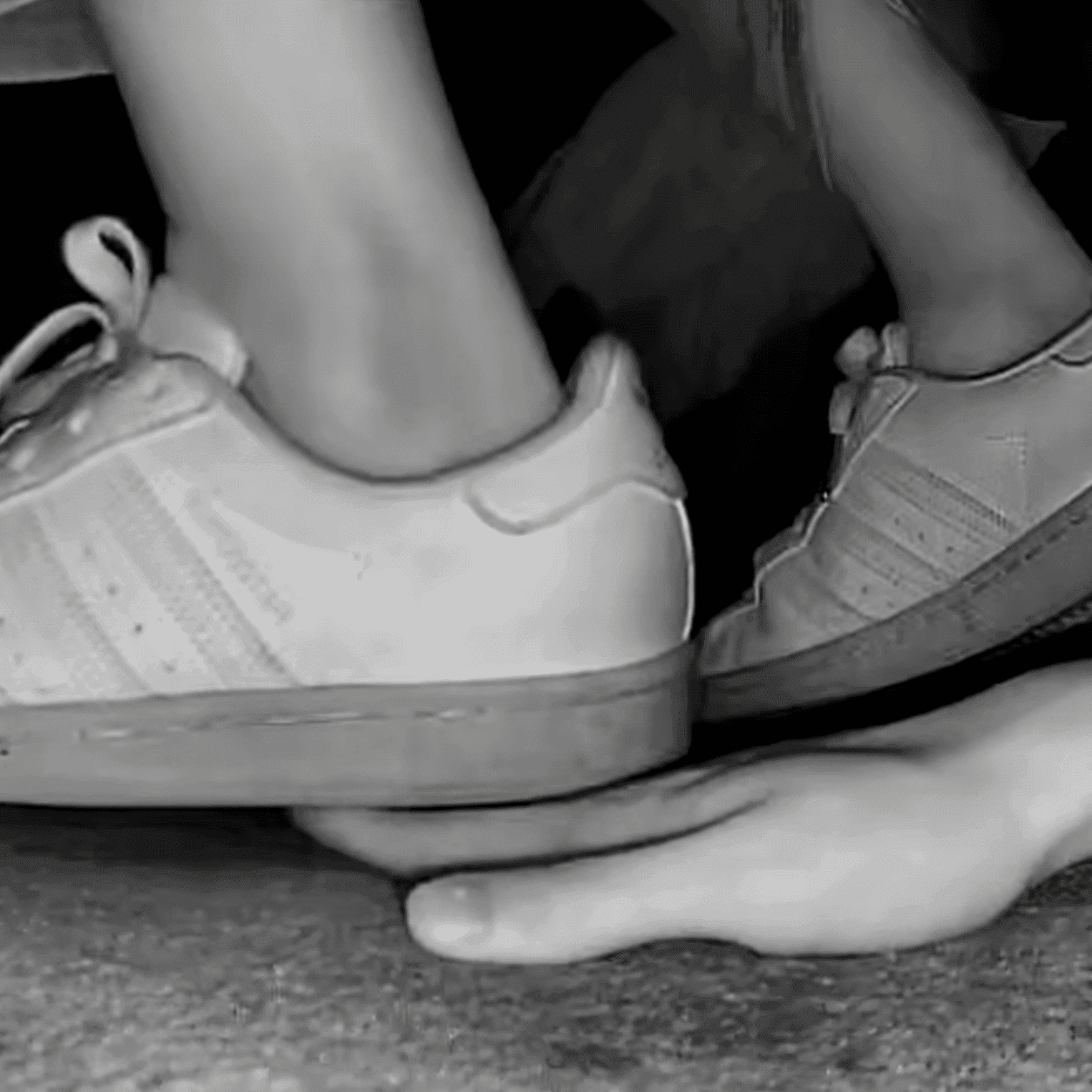 Woman unaware hand trample with Nike Air Force 1 and sneakers at the cinema