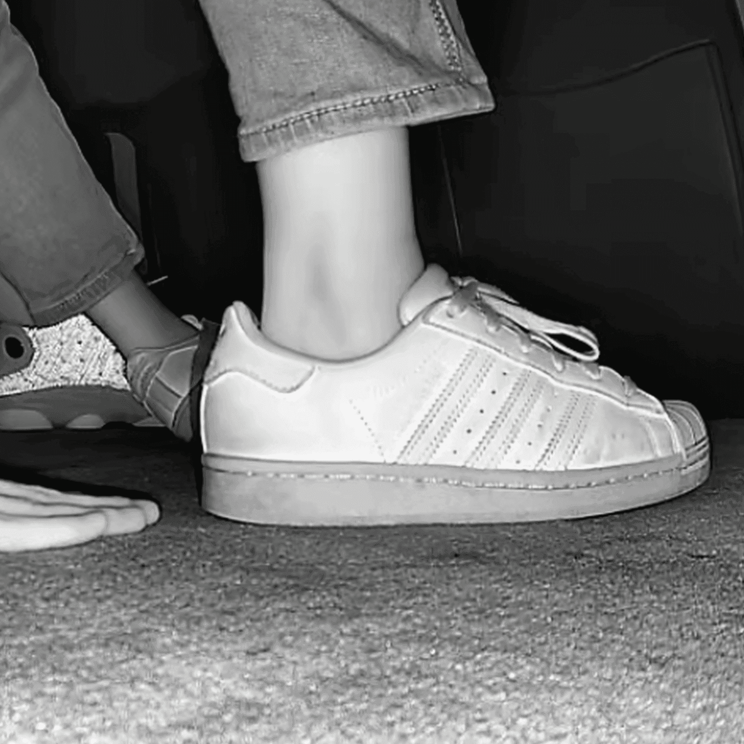 Woman unaware hand trample with Nike Air Force 1 and sneakers at the cinema