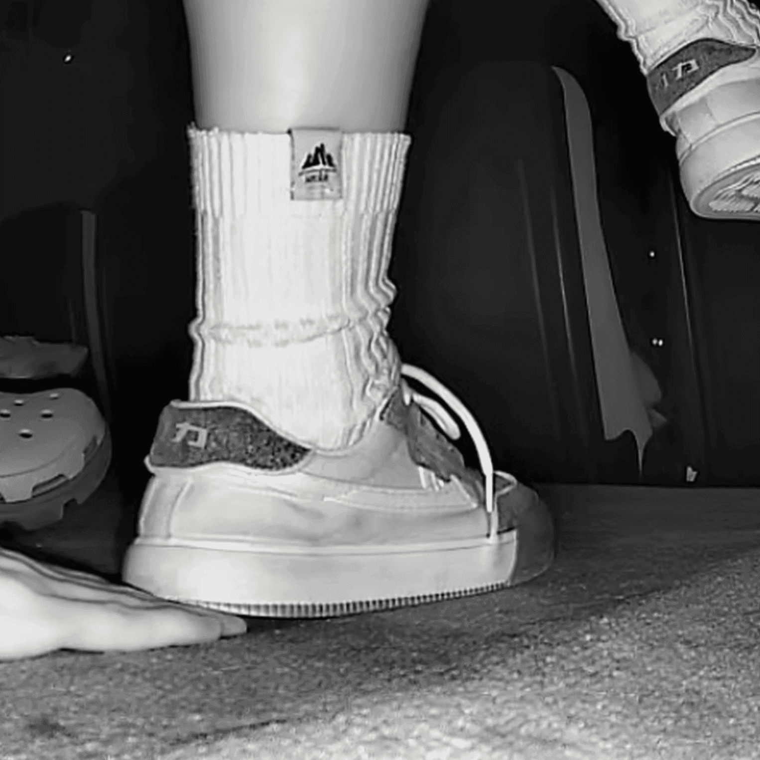 Woman unaware hand trample with Nike Air Force 1 and sneakers at the cinema