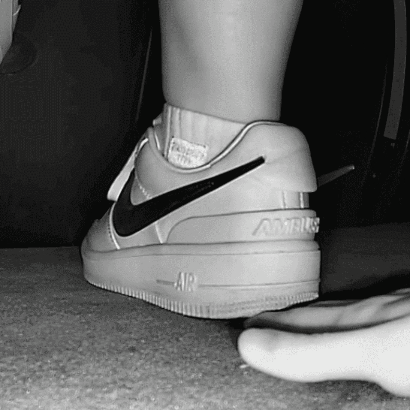 Cinema girl candid stepping on hand with Nike Air Force 1 sneakers