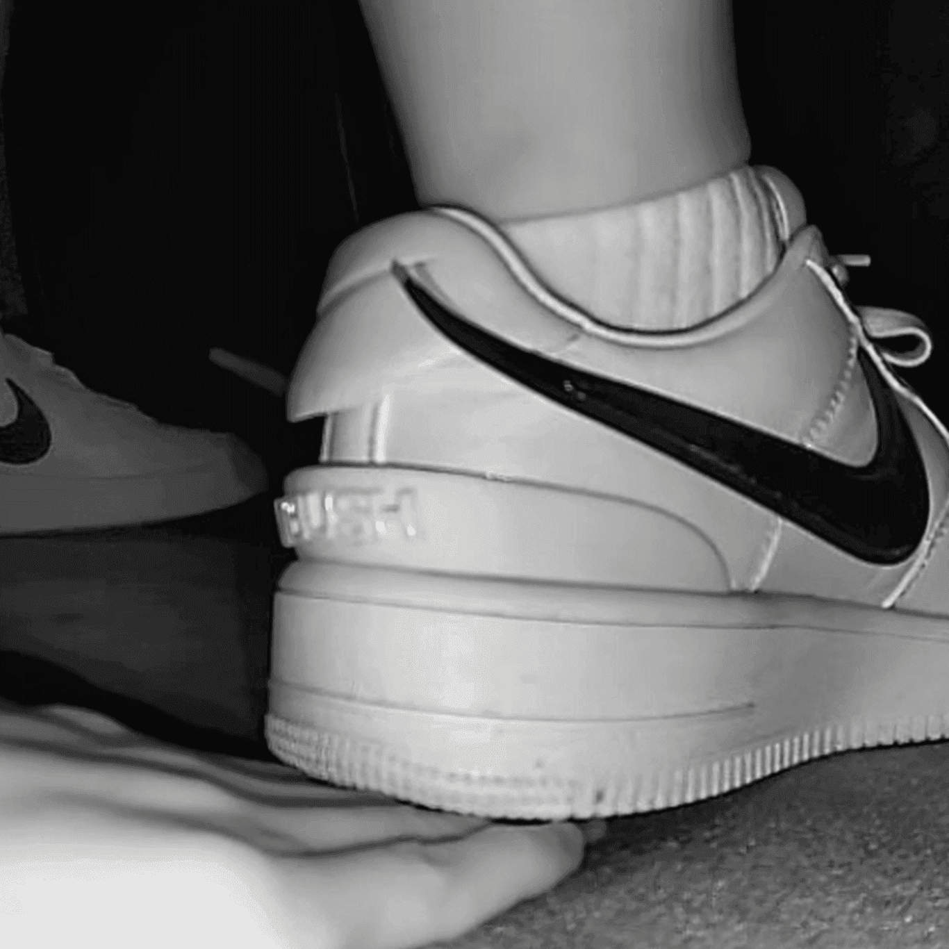 Cinema girl candid stepping on hand with Nike Air Force 1 sneakers