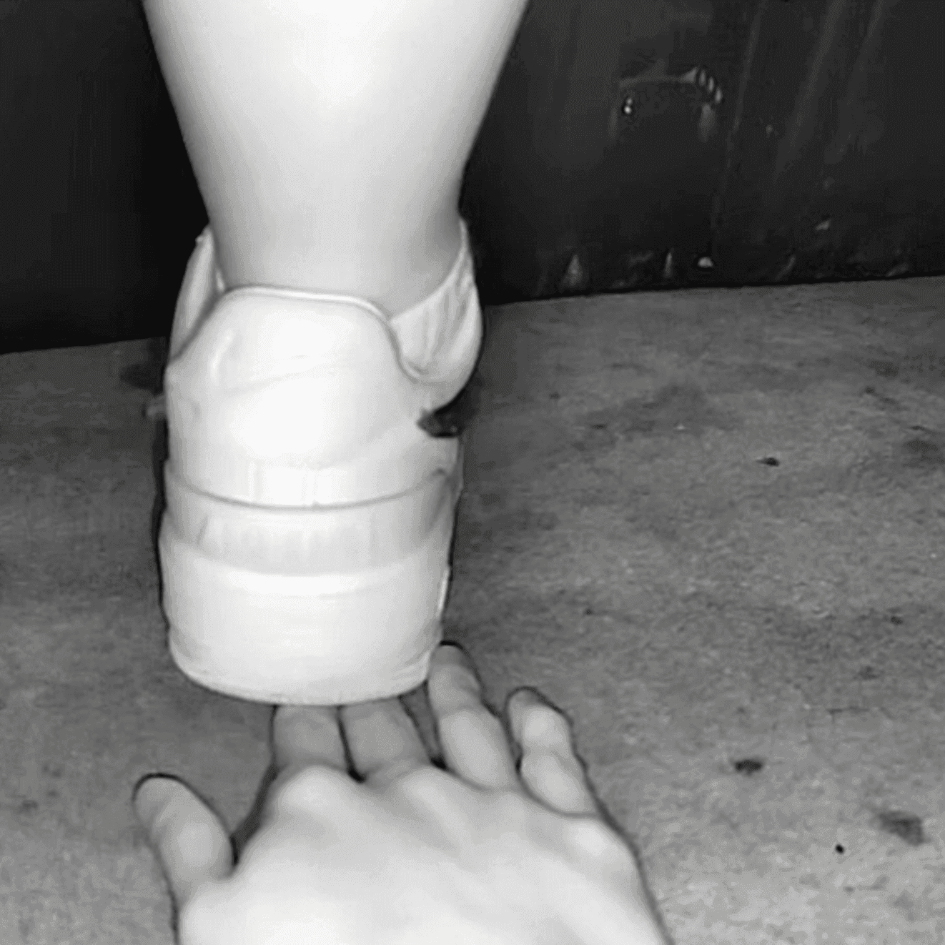 Cinema girl candid stepping on hand with Nike Air Force 1 sneakers