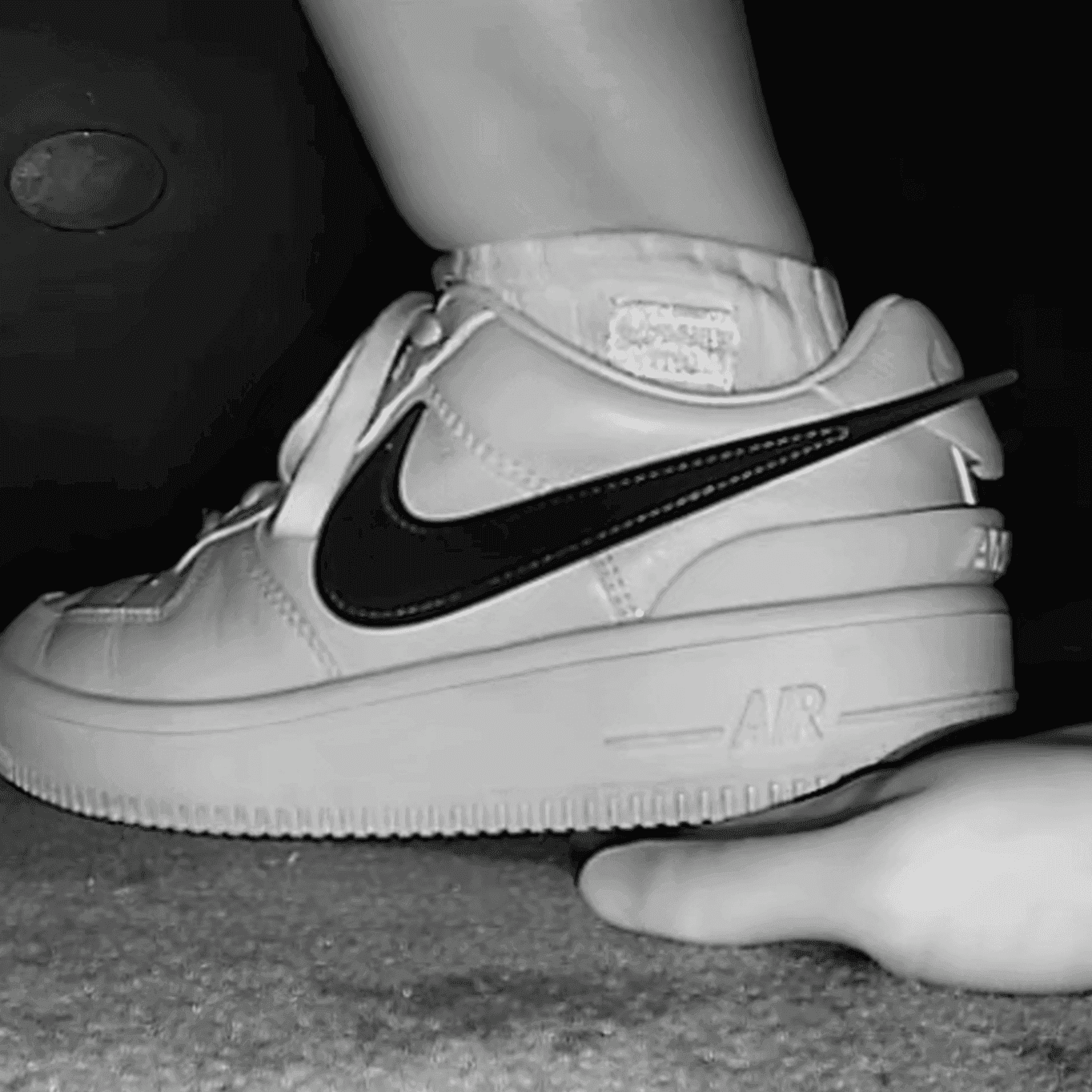 Cinema girl candid stepping on hand with Nike Air Force 1 sneakers