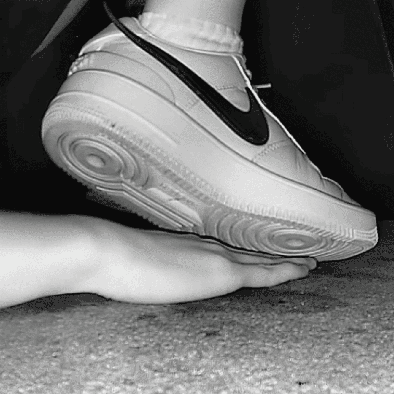 Cinema girl candid stepping on hand with Nike Air Force 1 sneakers