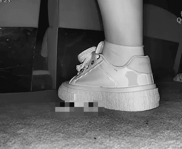 Woman in cinema candid crush with white sneakers