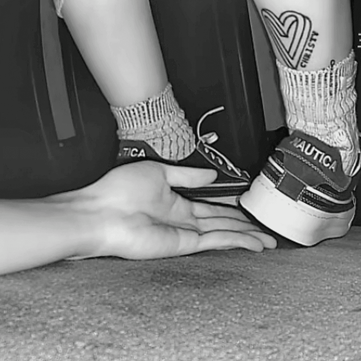 Girl in sneakers candid hand trample at cinema