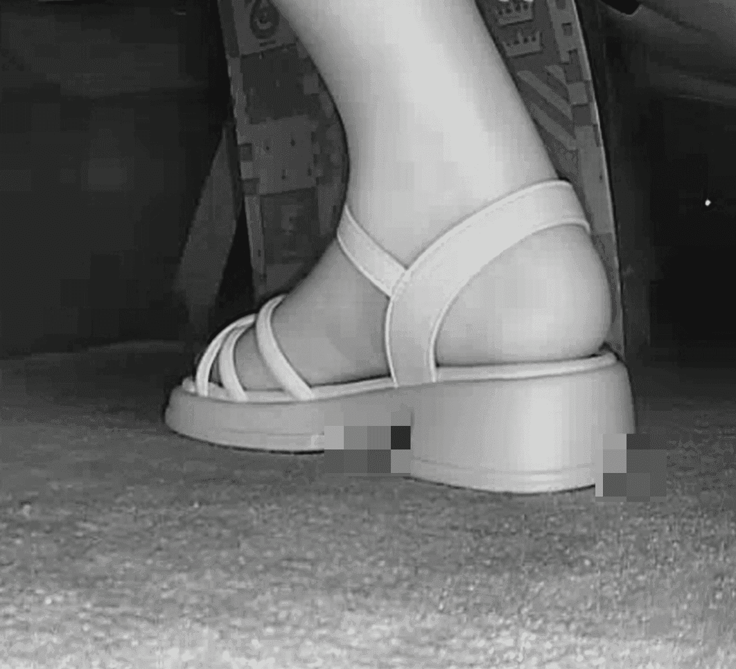 Women in movie theater candid crush with white sandals