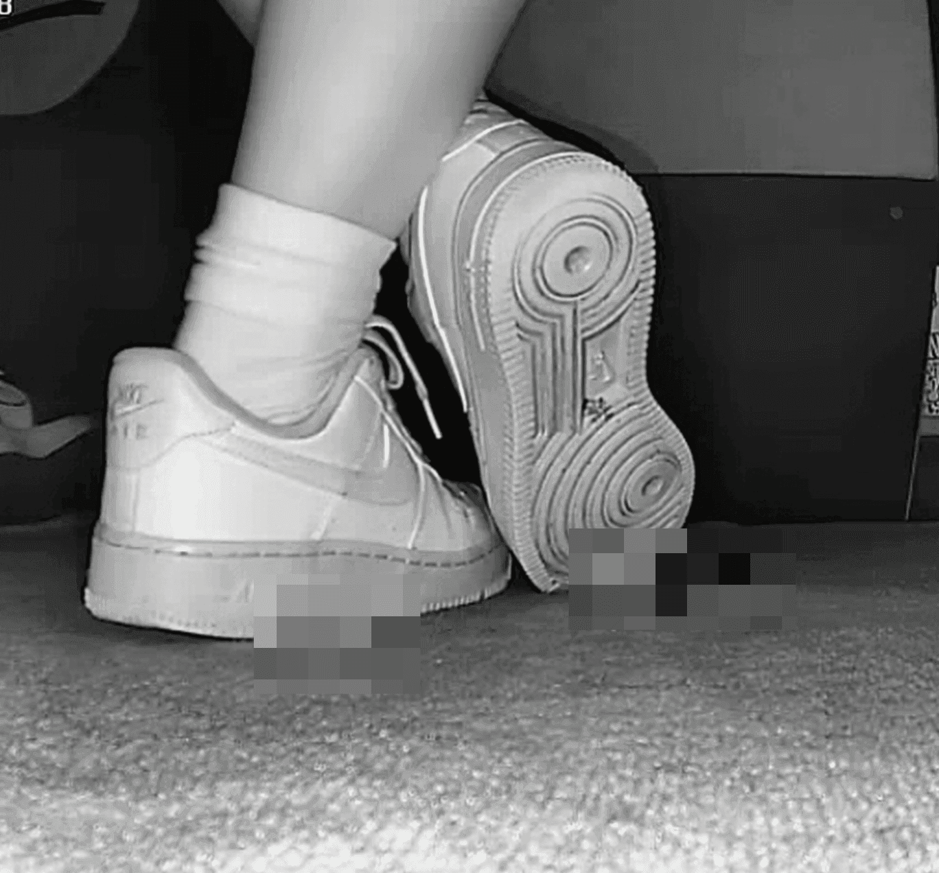 Woman candid crush with white socks and Nike Air Force 1 in cinema