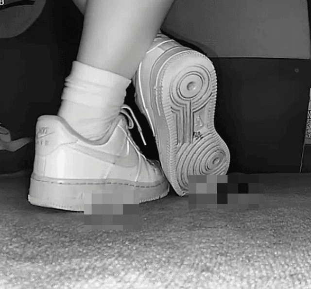 Woman candid crush with white socks and Nike Air Force 1 in cinema