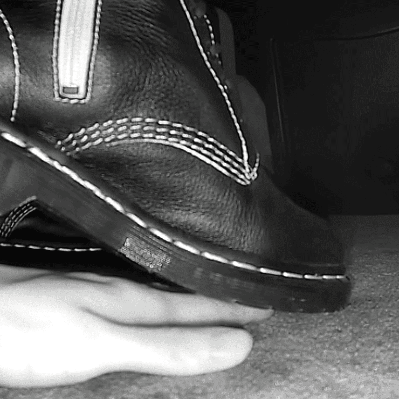 Women in cinema candid hand trample with Martin boots + leather shoes