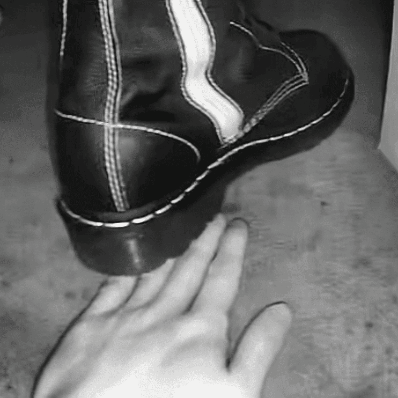Women in cinema candid hand trample with Martin boots + leather shoes