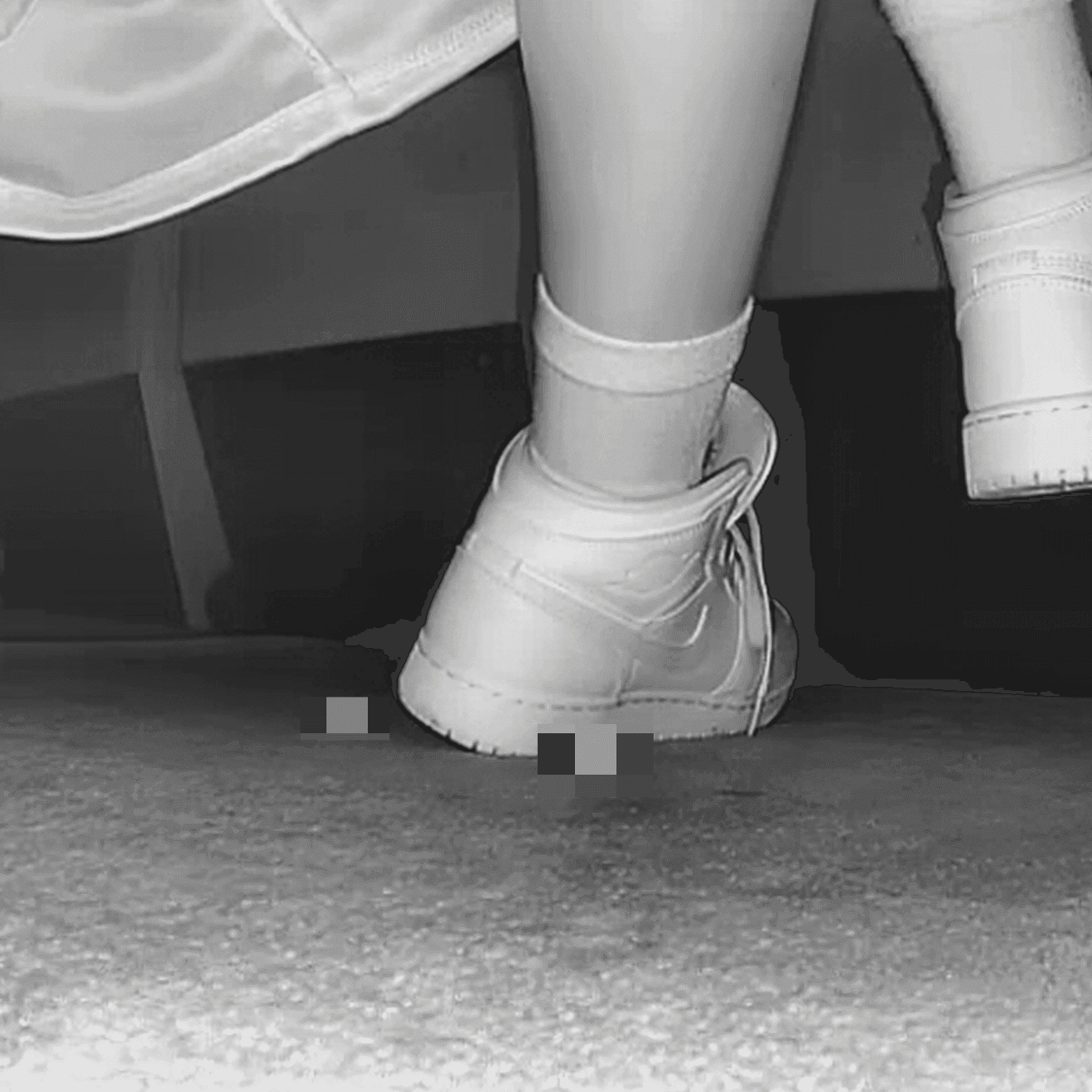 Woman at cinema with white high-top Nike Air Jordan sneakers candid crush
