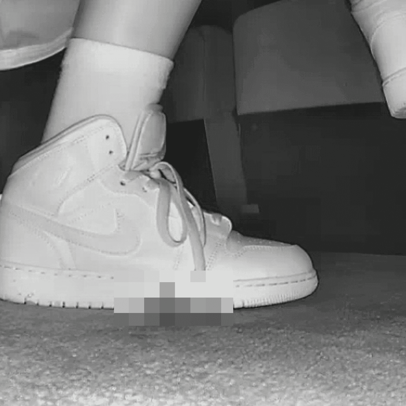 Woman at cinema with white high-top Nike Air Jordan sneakers candid crush