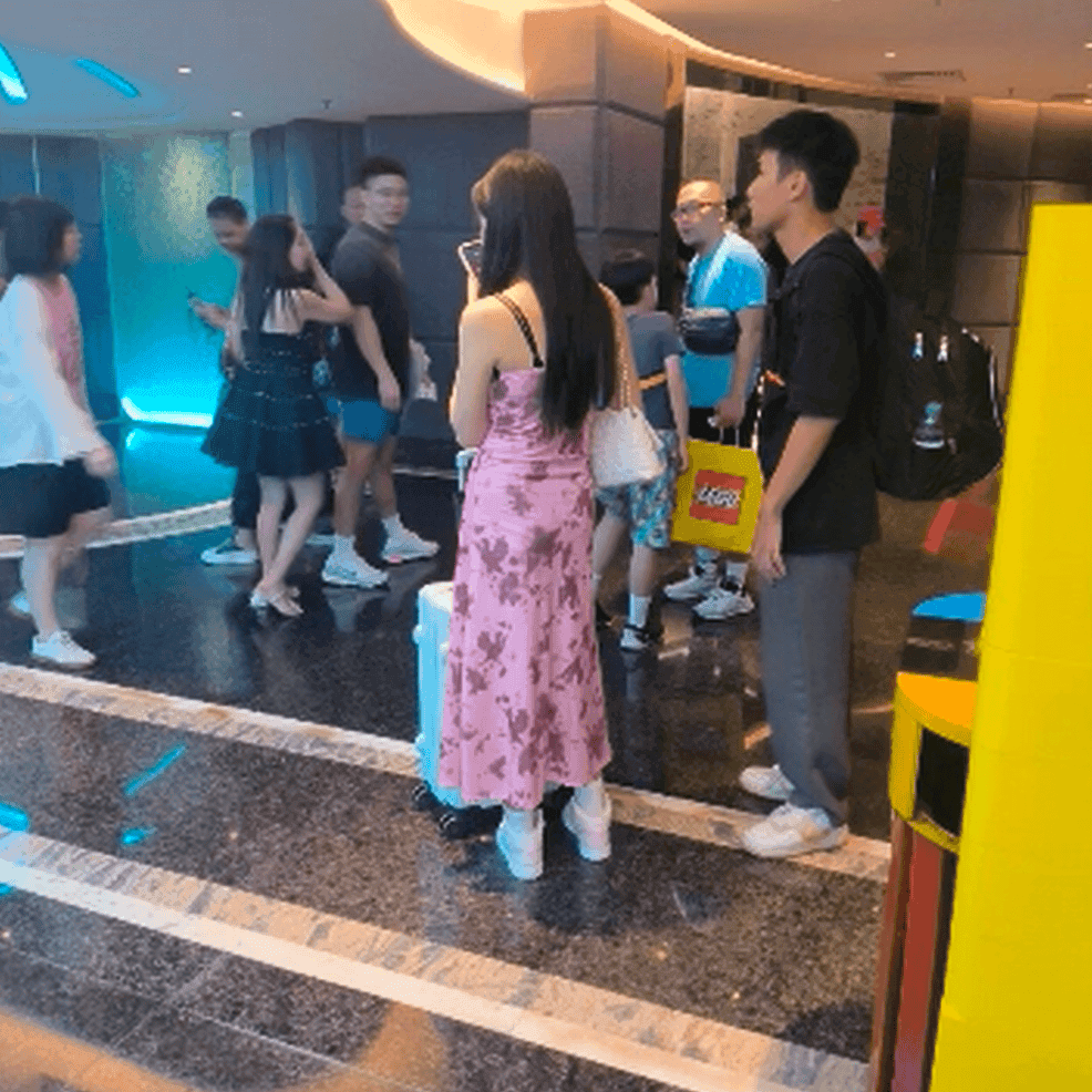 Woman at cinema with white high-top Nike Air Jordan sneakers candid crush