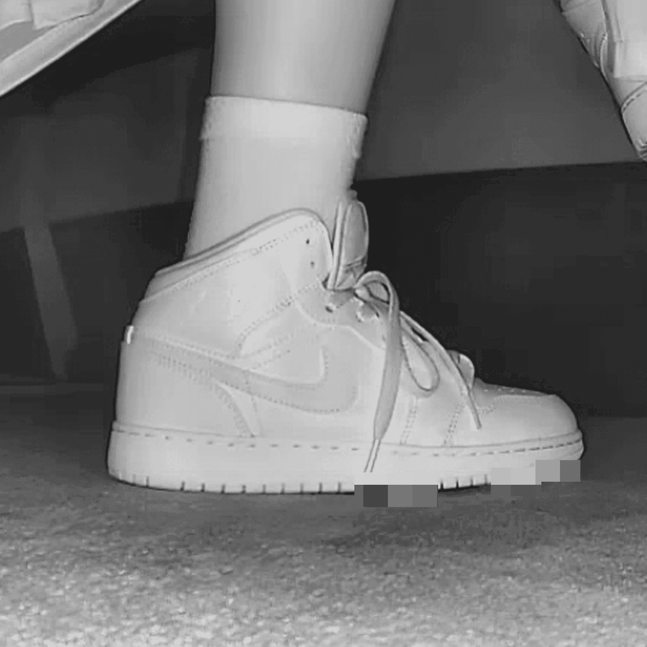 Woman at cinema with white high-top Nike Air Jordan sneakers candid crush