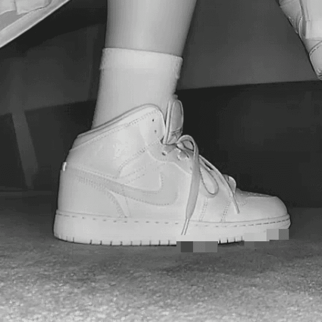 Woman at cinema with white high-top Nike Air Jordan sneakers candid crush