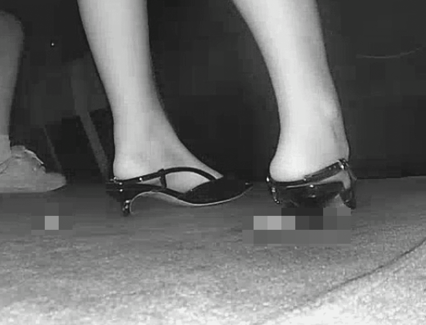 Woman candid crush with stiletto heels in cinema