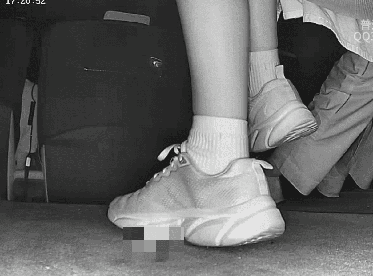 Woman in sneakers and white socks candid crush in movie theater