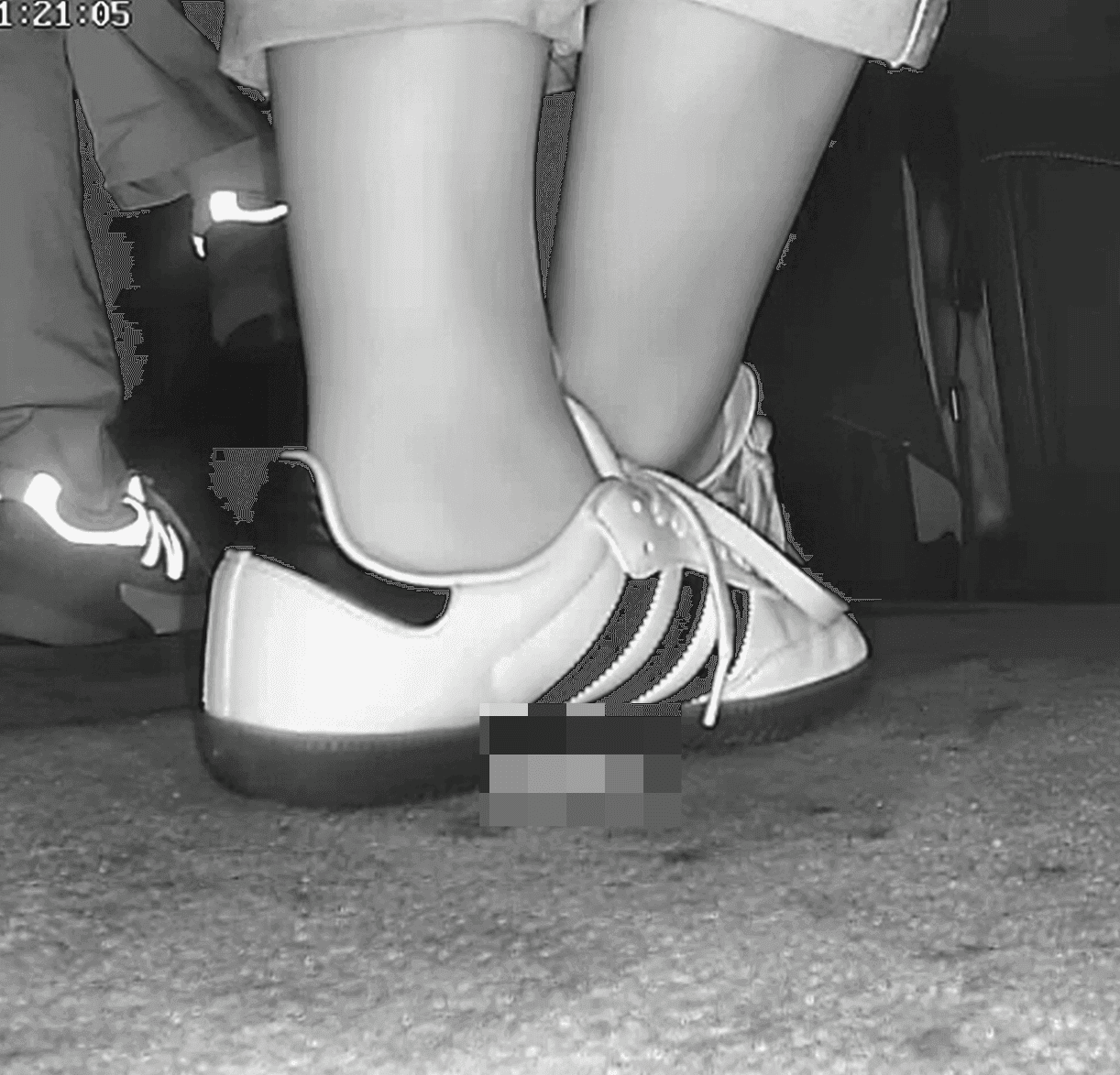 Woman in Adidas Samba sneaker candid crush in movie theater