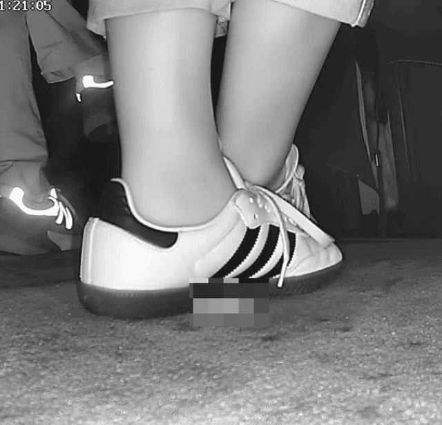 Woman in Adidas Samba sneaker candid crush in movie theater