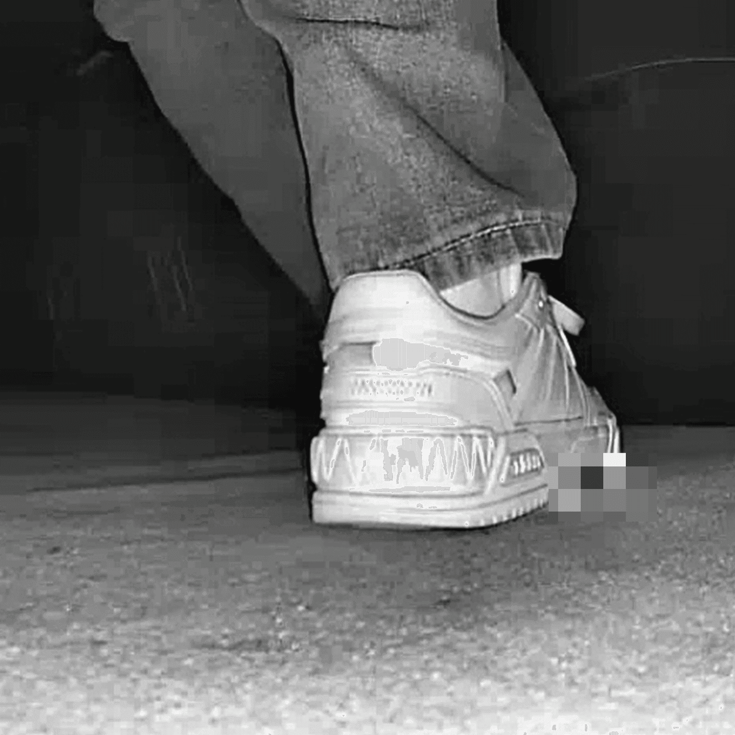 Young woman in cinema candid crush with white sneakers