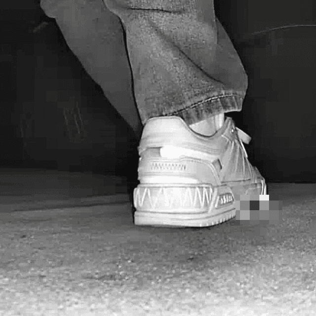 Young woman in cinema candid crush with white sneakers