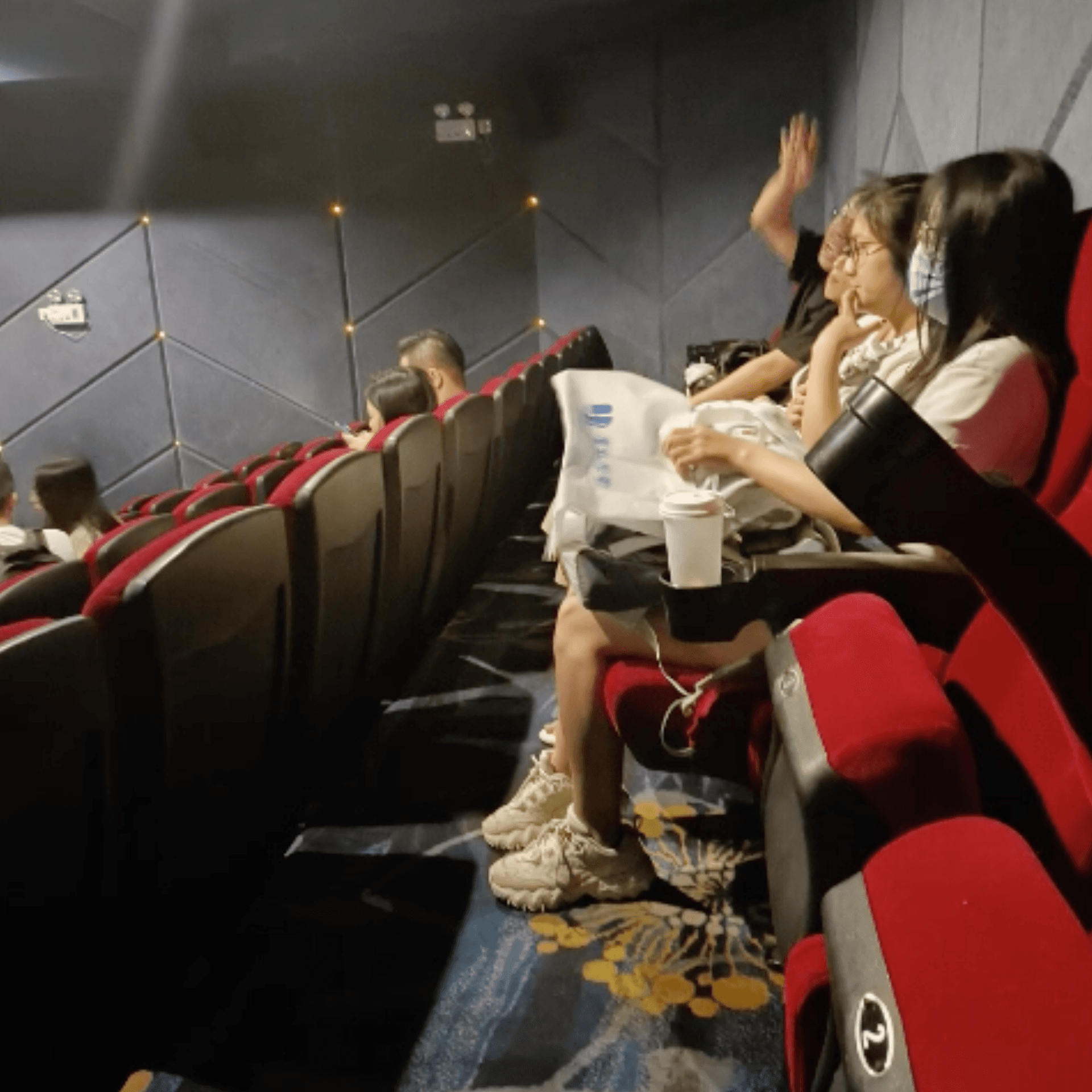 Girl adidas superstar + fila sneaker hand trample in cinema