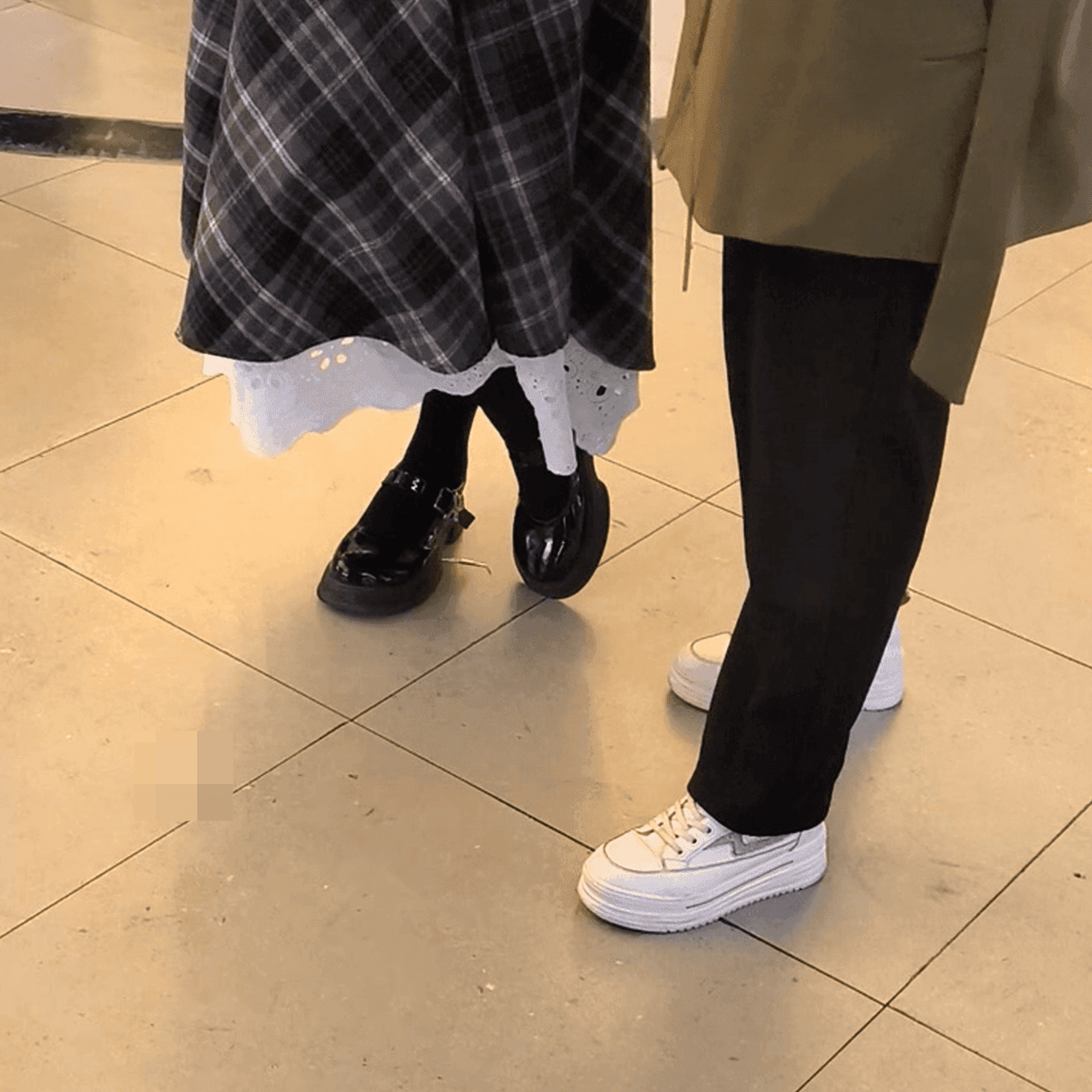 Cosplay girl in anime convention candid crush with black Converse shoes