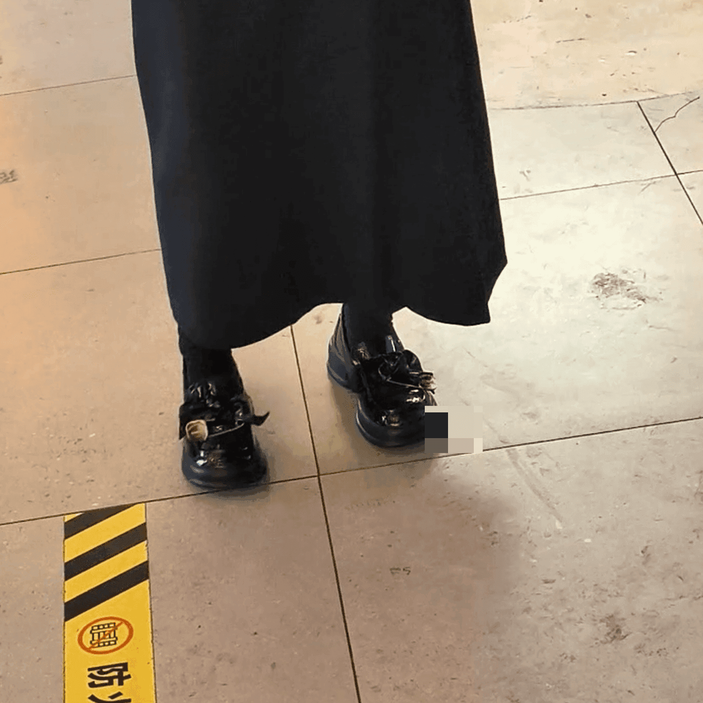 Cosplay girl in anime convention candid crush with black Converse shoes