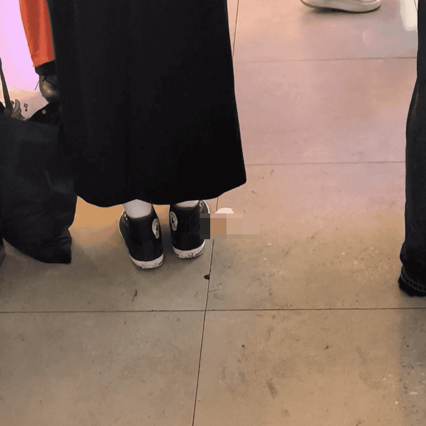 Cosplay girl in anime convention candid crush with black Converse shoes