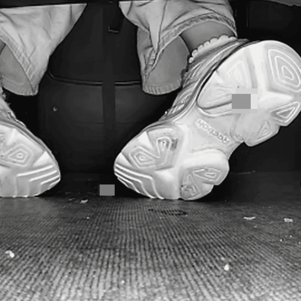Woman candid crush with Reebok sneaker + sneaker candid hand trample in the cinema