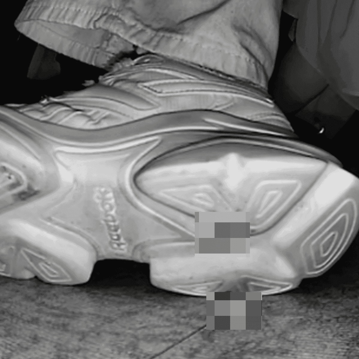 Woman candid crush with Reebok sneaker + sneaker candid hand trample in the cinema
