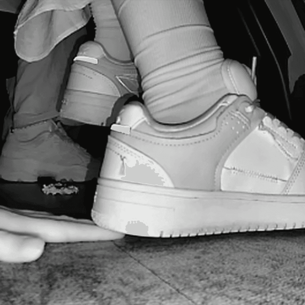 Woman candid crush with Reebok sneaker + sneaker candid hand trample in the cinema