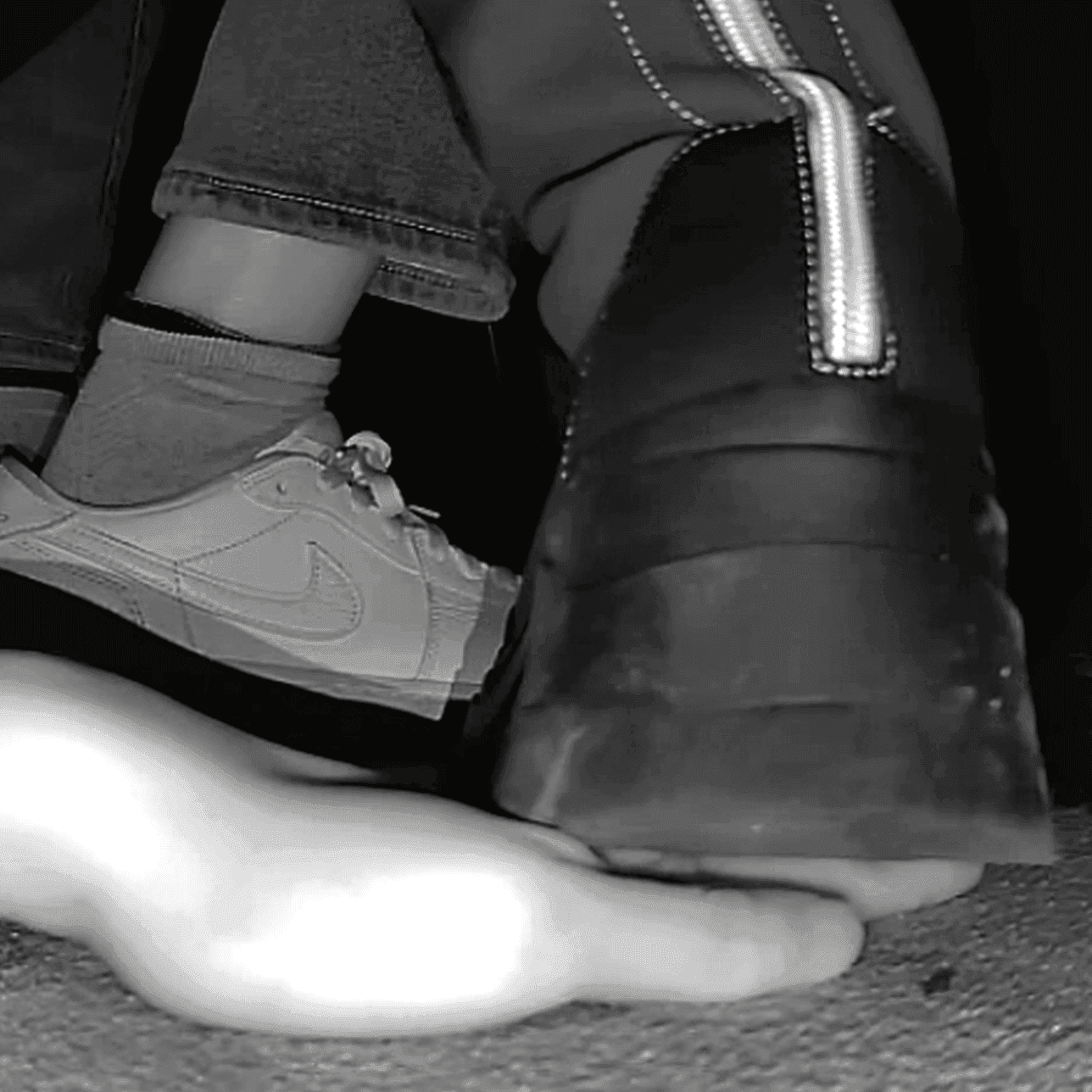 Woman at cinema candid hand trample with chunky-heeled knee-high boots