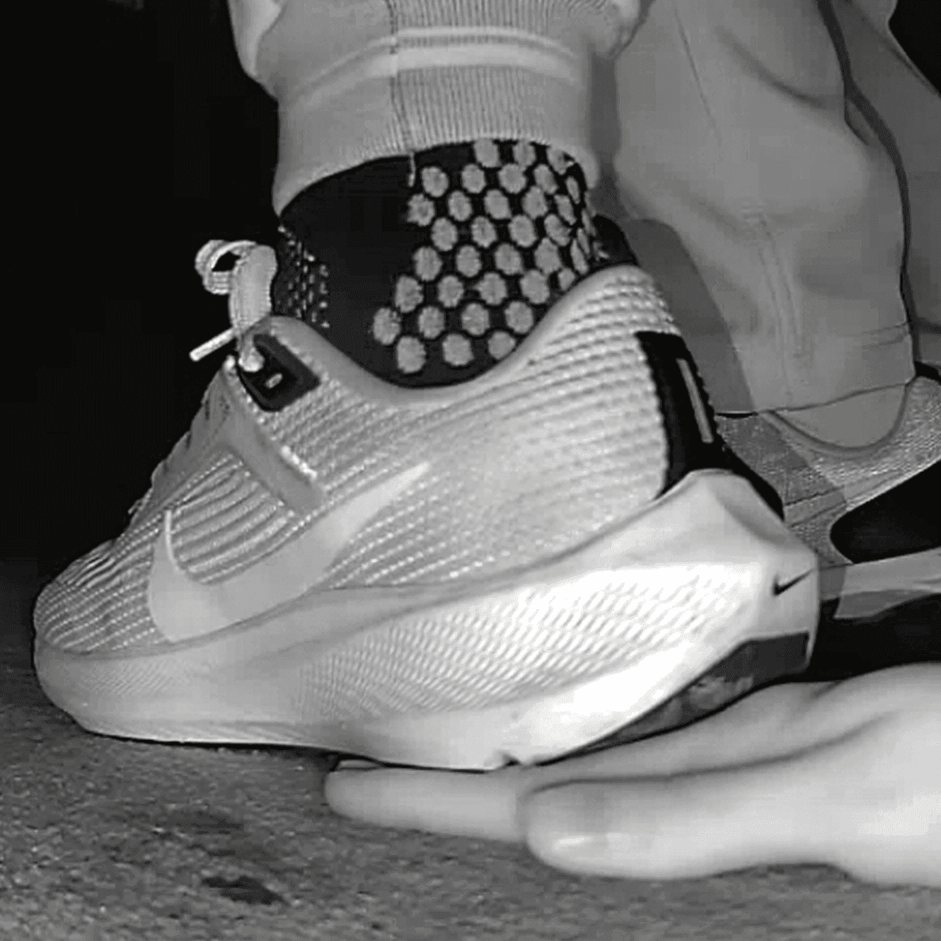 Cinema young girl candid hand trample with Nike running shoes