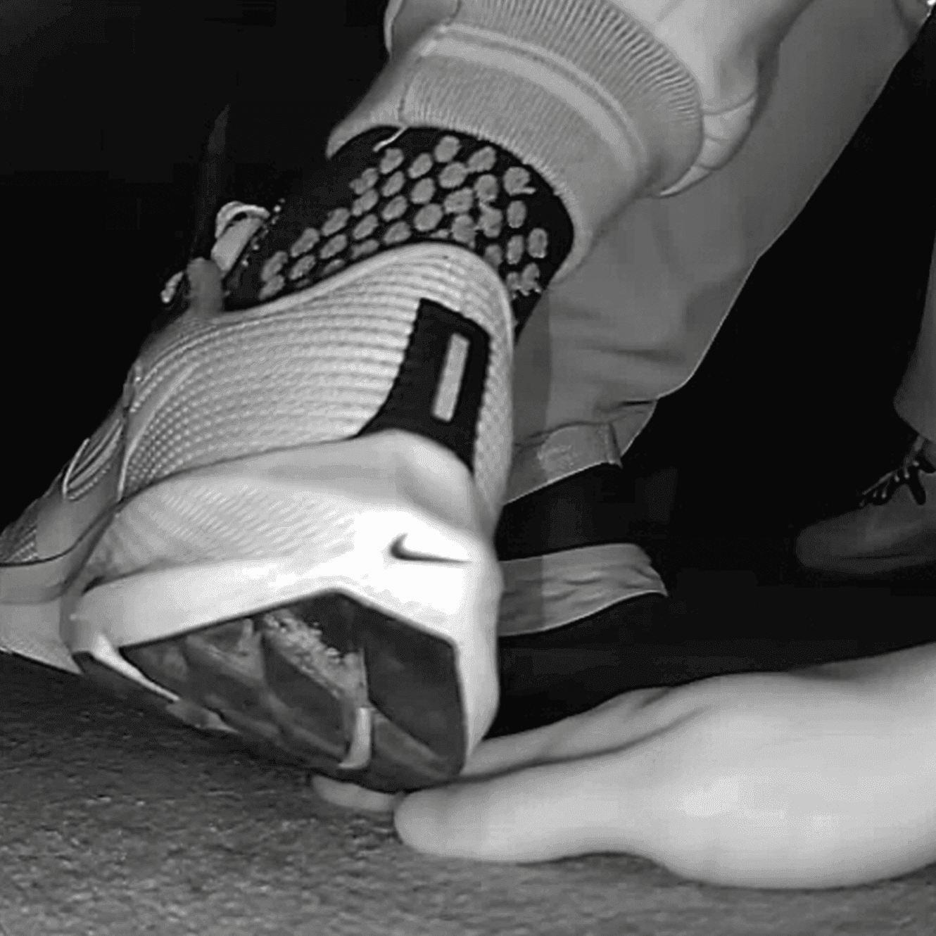 Cinema young girl candid hand trample with Nike running shoes