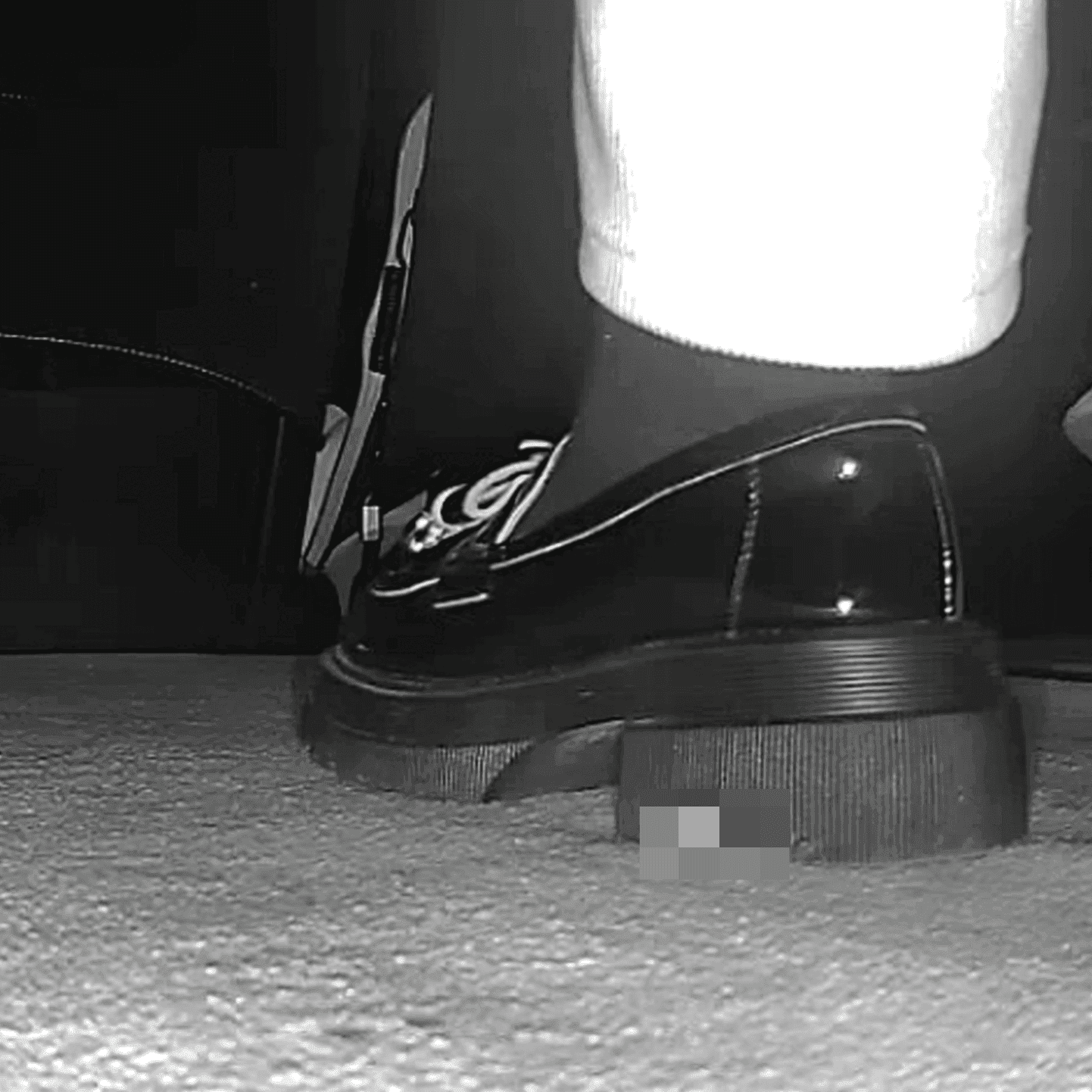 Young woman in cinema candid crush with sneakers and stuck to her sole