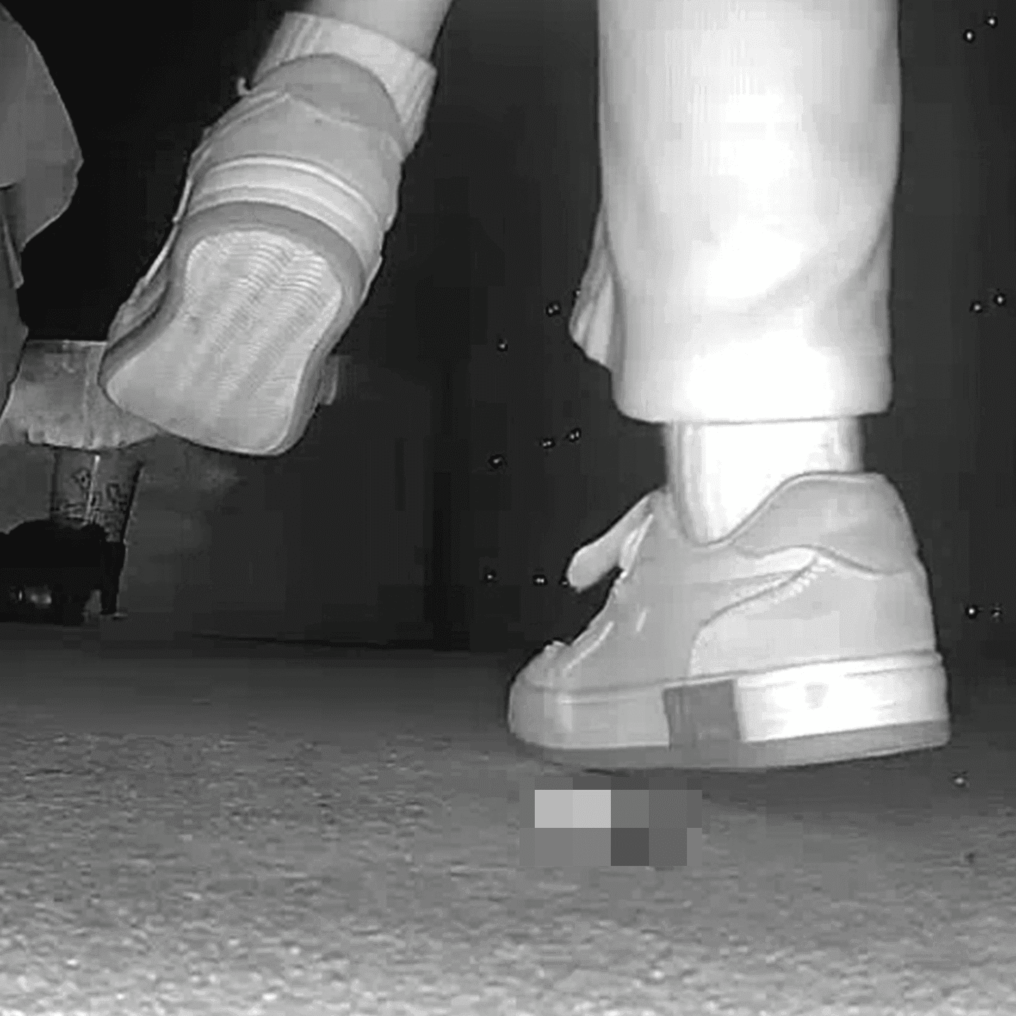 Young woman in cinema candid crush with sneakers and stuck to her sole