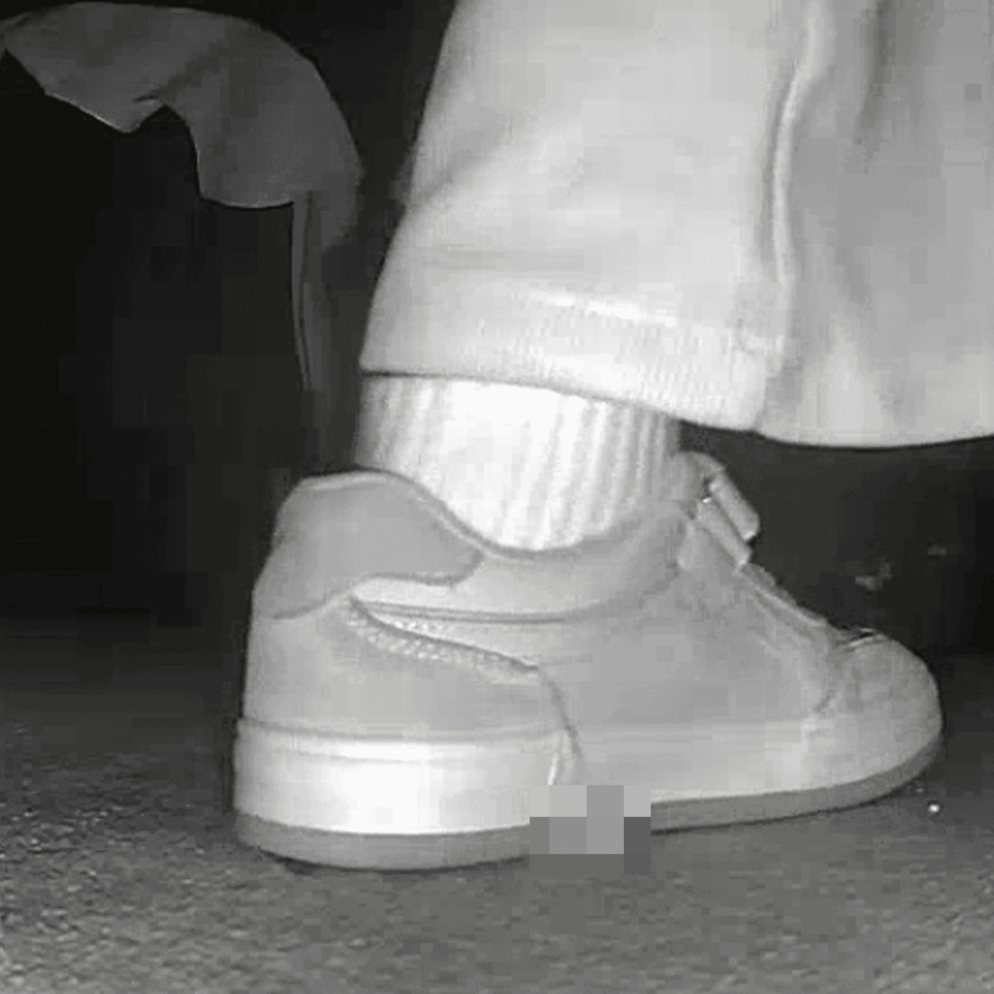 Young woman in cinema candid crush with sneakers and stuck to her sole